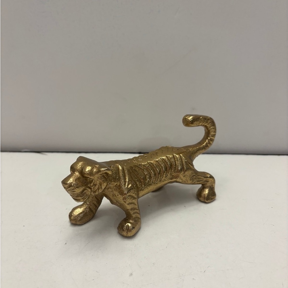 Small golden color tiger figurine